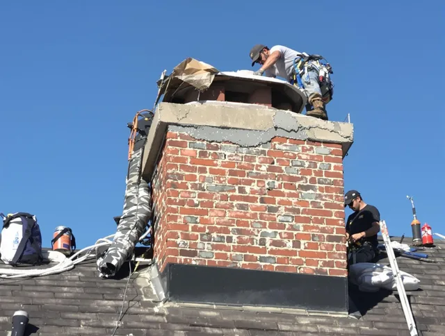Rancho Cucamonga Chimney Sweep installing a custom chimney crown in Rancho Cucamonga, CA